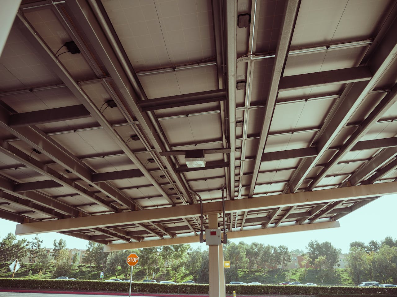 View of a metal roofing structure with reinforcement, outdoors during the day.